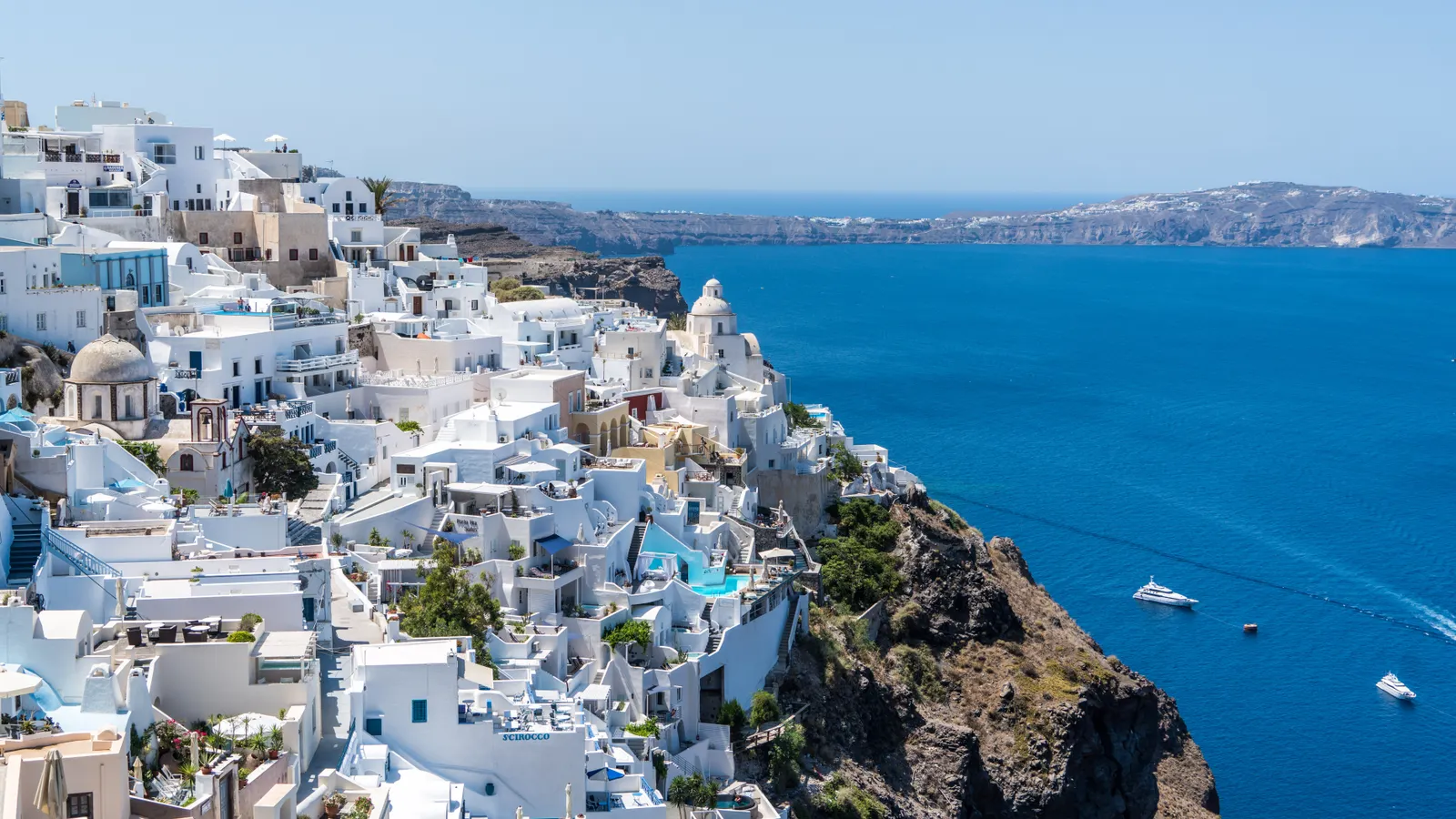 Whitewashed Santorini buildings above the Aegean Sea